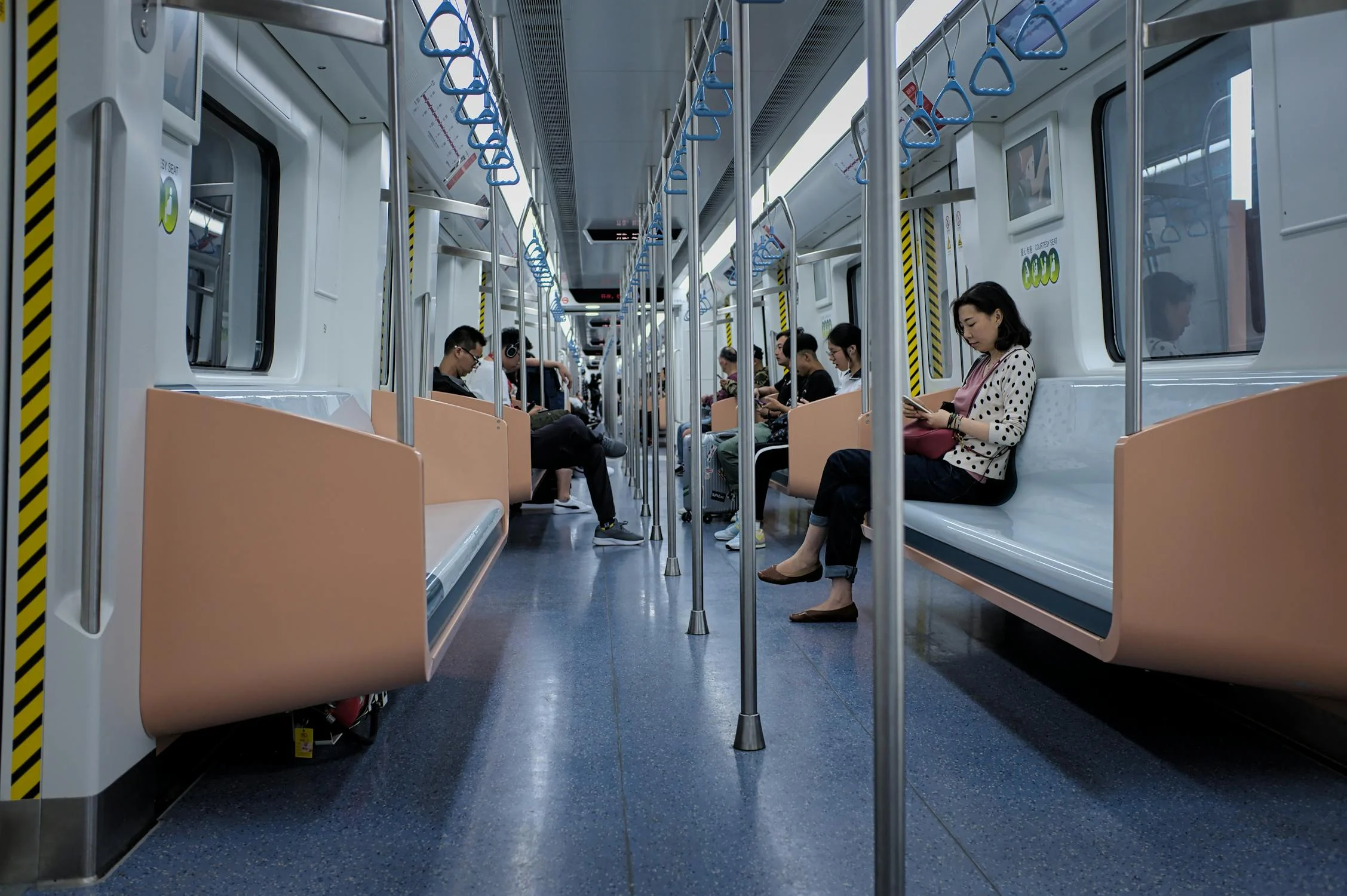 A photo of people sitting in the MRT