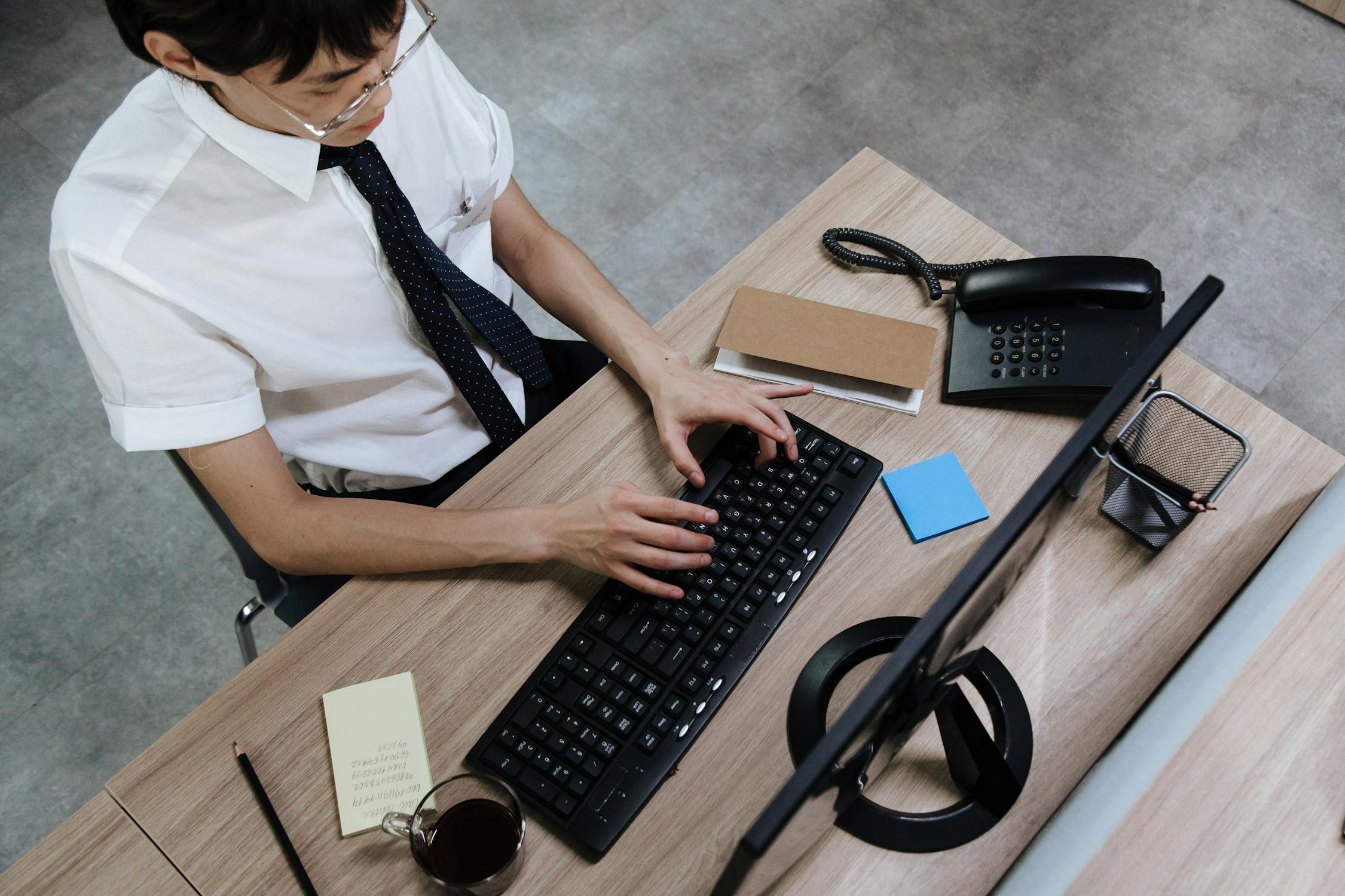 an employee working at his desk with computer